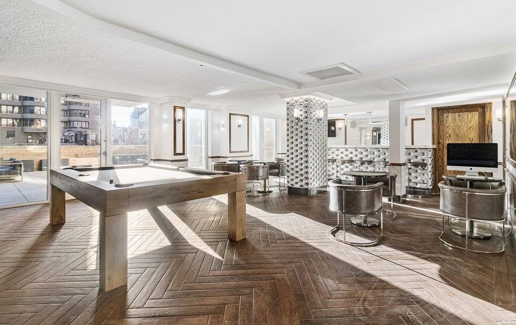 High floor one bedroom with balcony, hardwood floors, and renovated modern kitchen with stainless appliances now available at New York Tower.
