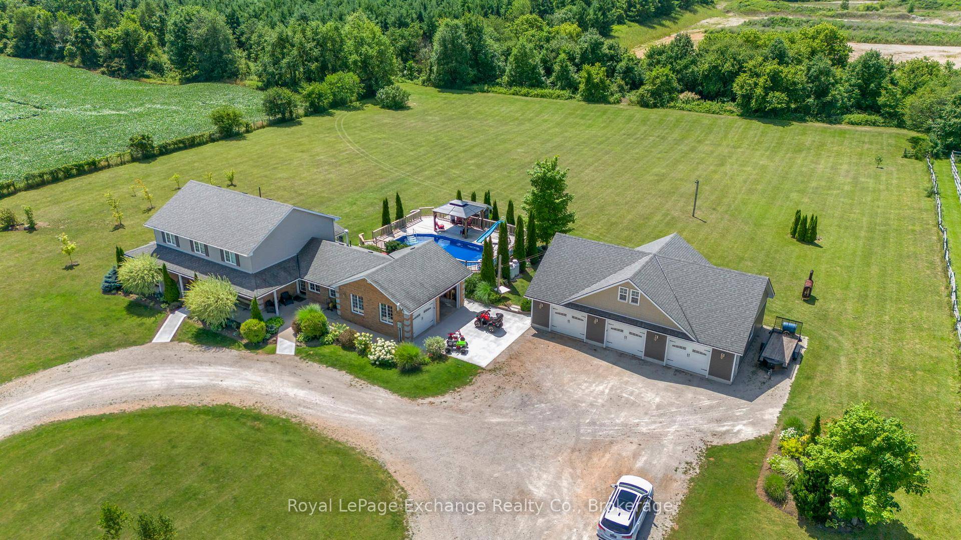 This captivating country property, located in close proximity to town, boasts exceptional outdoor charm.