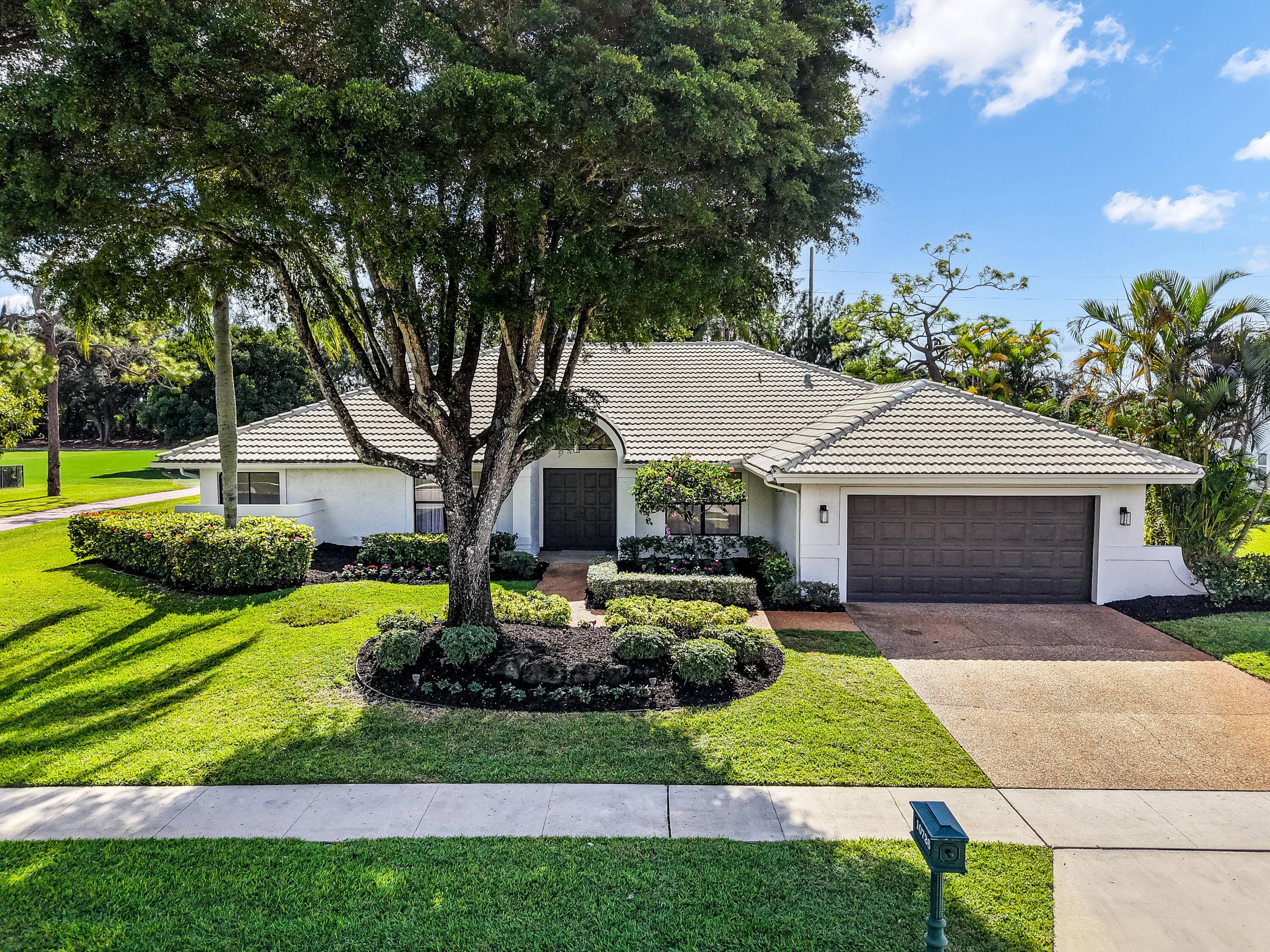 Experience the best of golf and country club living in this beautiful modern house for rent in Boca Woods Country Club.