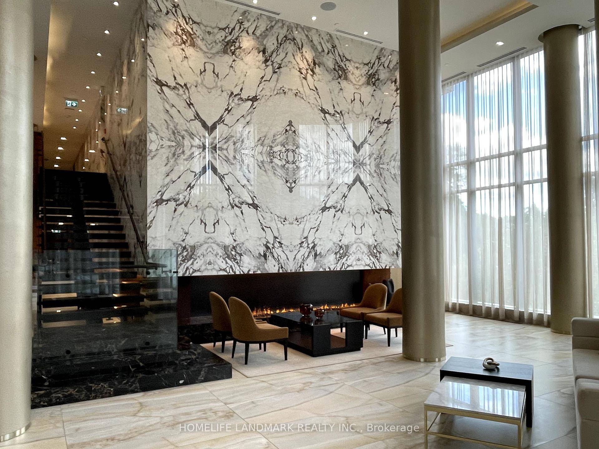 Luxury Living at Tridel Scala Elegant 1 Den, 2 Bath residence featuring a spacious open concept layout, soaring 9 ceilings, sleek laminate flooring amp ; a versatile den.