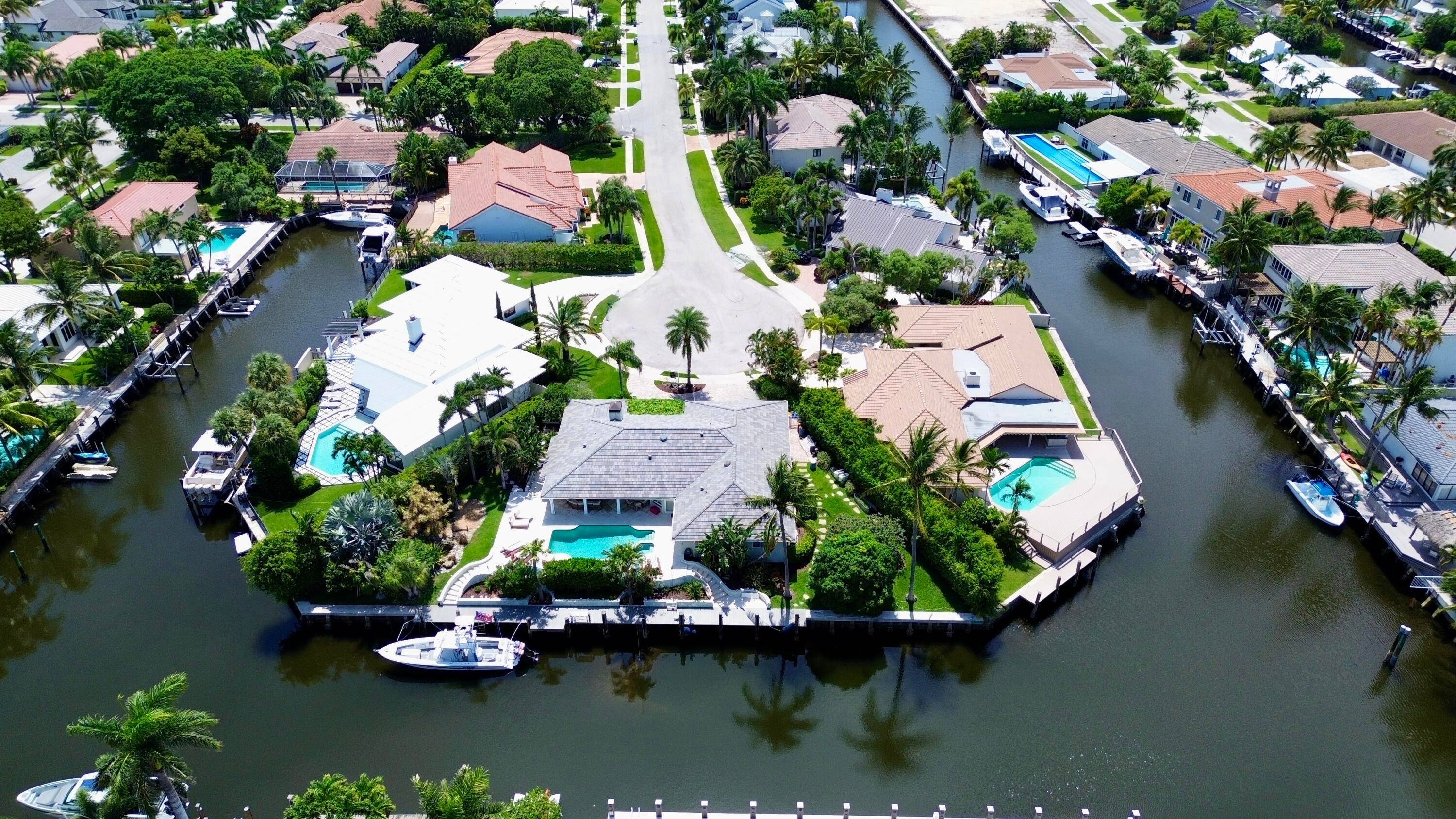 EXCEPTIONAL EAST BOCA RATON HOME WITH 180' OF STRAIGHT WATERFRONT WITH DEEP WATER ACCESS NO FIXED BRIDGES !