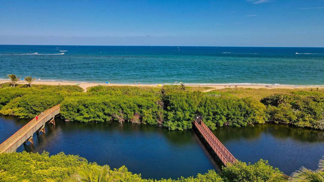 Introducing 1776 Bay Drive, tucked in the unique, boutique gated townhome community of Hillsboro Bay by the Sea.