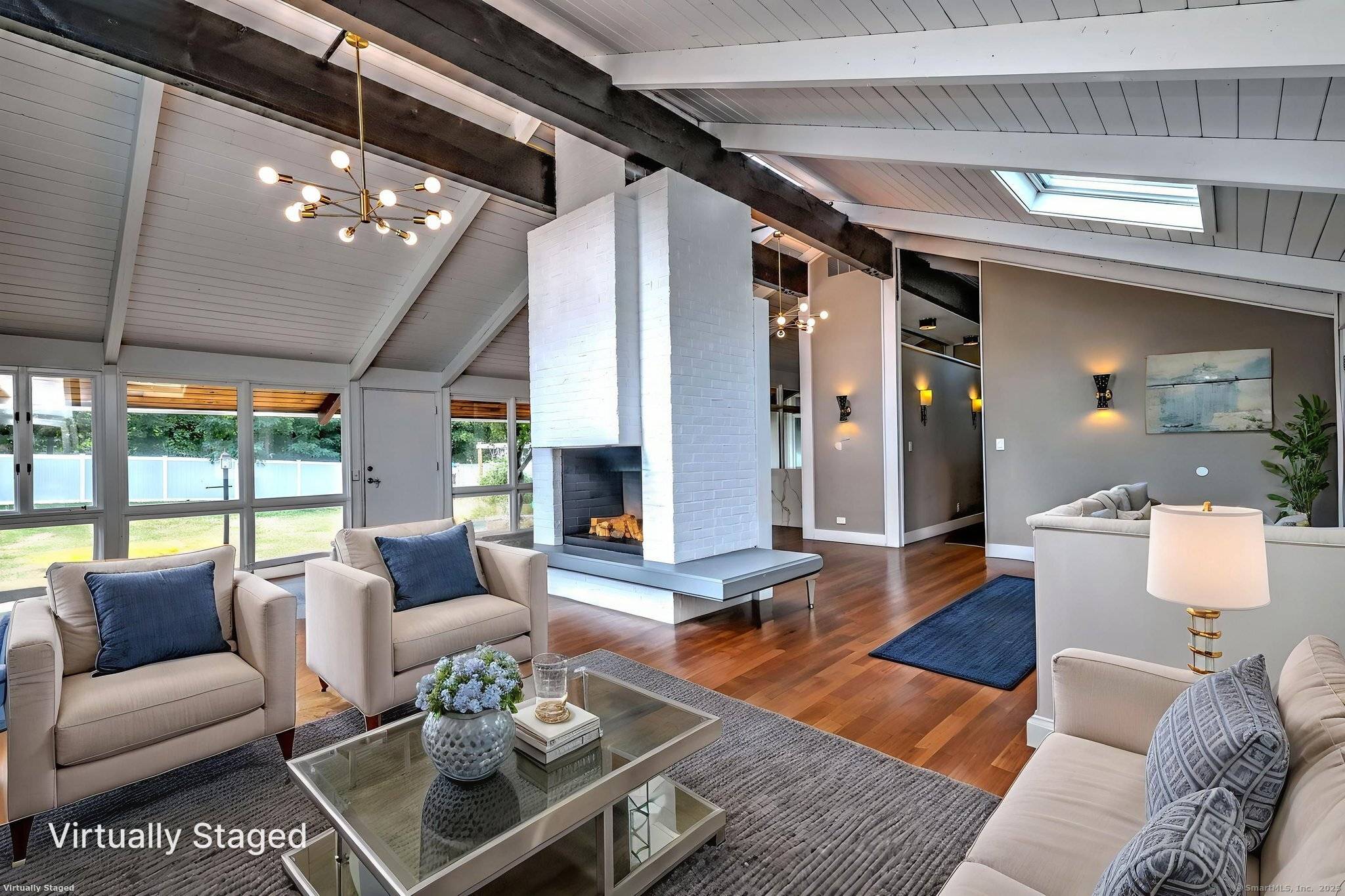 Welcome to 65 High Meadow, a beautifully updated Mid Century Modern home originally designed by Earl Carlin of Pozzi Carlin located in the heart of Spring Glen.