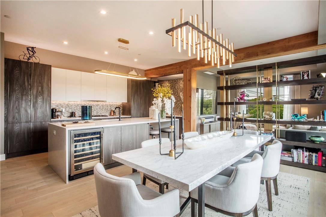 Discover the epitome of luxury living in this stunning duplex condo, offering breathtaking river views, multiple terraces covering the entirety of the second floor, and exquisite finishes.