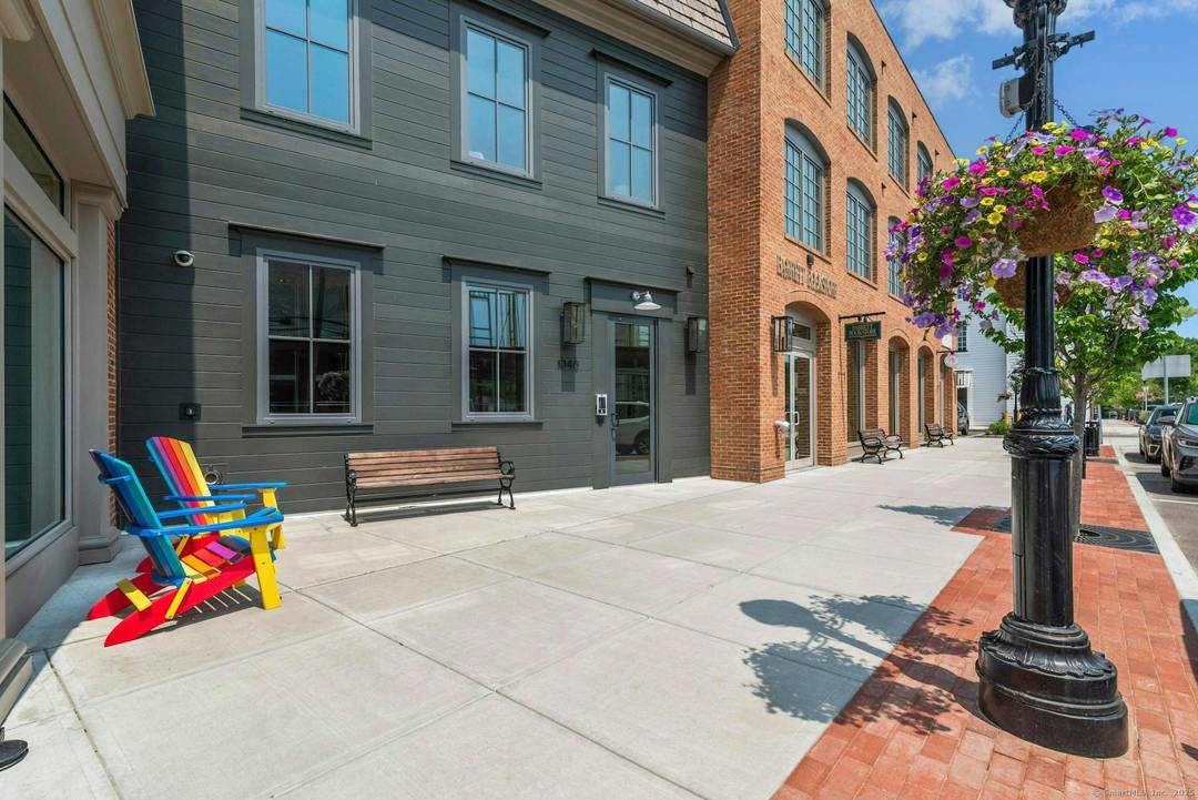 Step into this luxury corner unit that offers refined elegance, modern design, and privacy all in the heart of downtown Darien's premier neighborhood, The Corbin District.