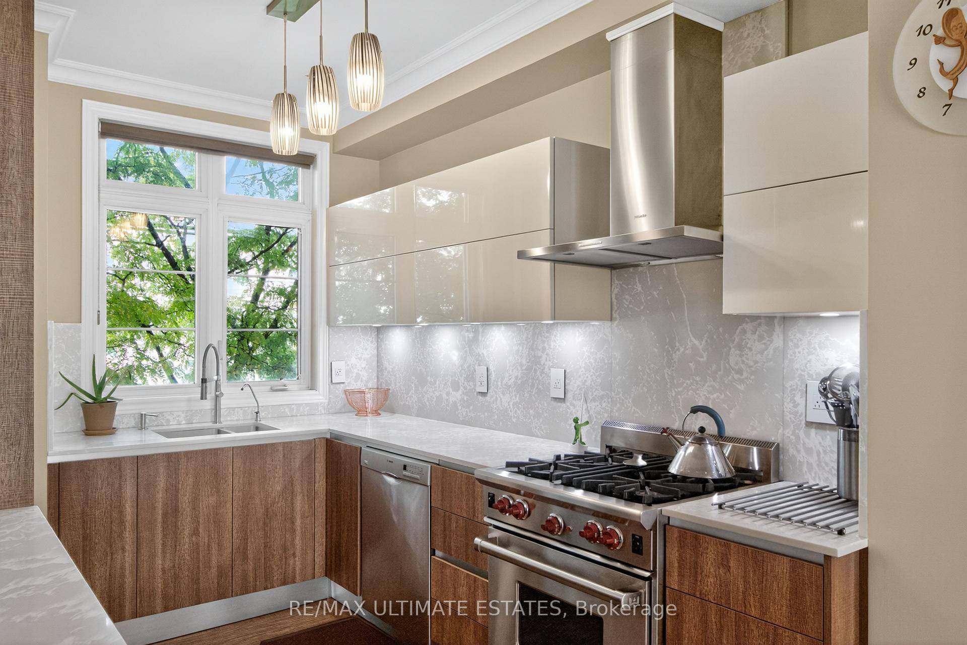 Stunning 4 bedroom townhouse with 9 ft ceilings, floor to ceiling windows, hardwood floors, built in speakers, and recessed lighting.