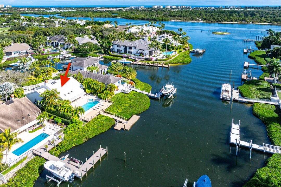Turnkey navigable waterfront living in Admirals Cove.