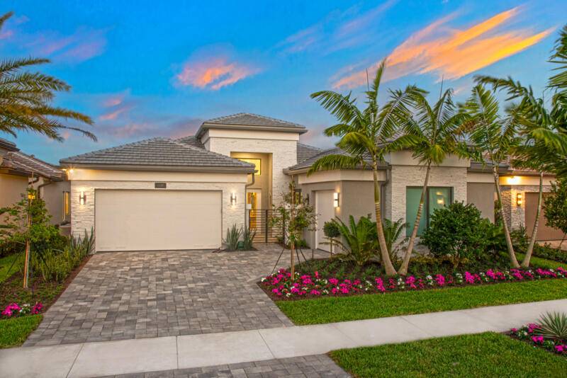Fully furnished, professionally decorated, turnkey Caroline Grande Builder Model Home with designer upgrades, luxury finishes, and a stunning poolside lake view.