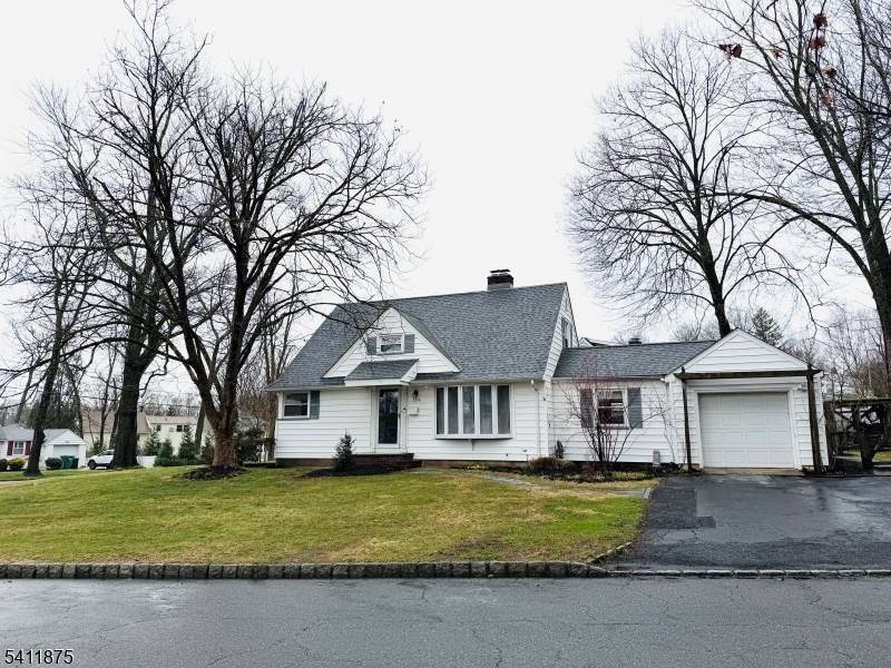 If you're looking for classic charm, modern comfort, and unbeatable convenience, this beautifully maintained 4 bedroom, 2 bath corner Cape Cod delivers.