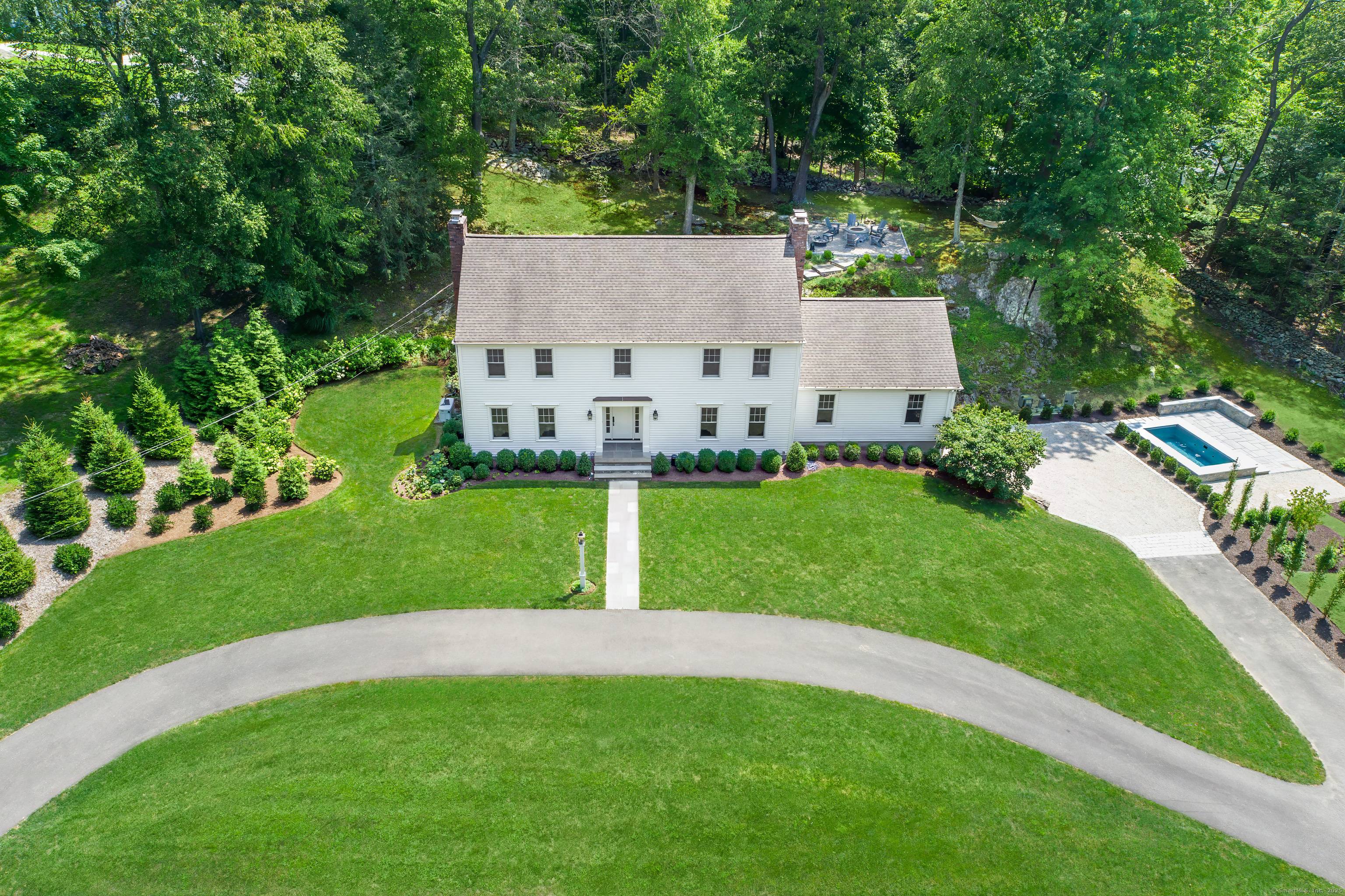 Welcome to this meticulously, well designed Connecticut Colonial beautifully sited on one of SW Ridgefield's most desirable cul de sacs.