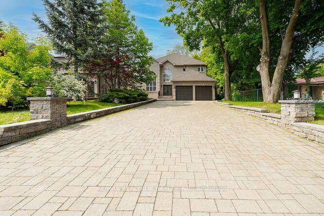 Stunning Custom Home On An Incredibly Beautiful Private Rectangular Lot Backing to Green on a Quite Cul De Sac.