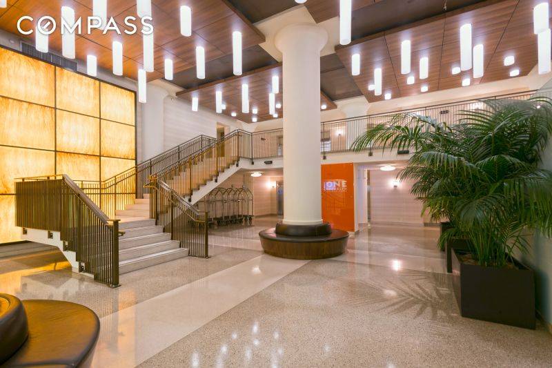 Welcome to Apartment 814 at 360 Furman Street a stylish and spacious apartment with a separate sleeping area, 13 foot ceilings, and breathtaking east facing views.