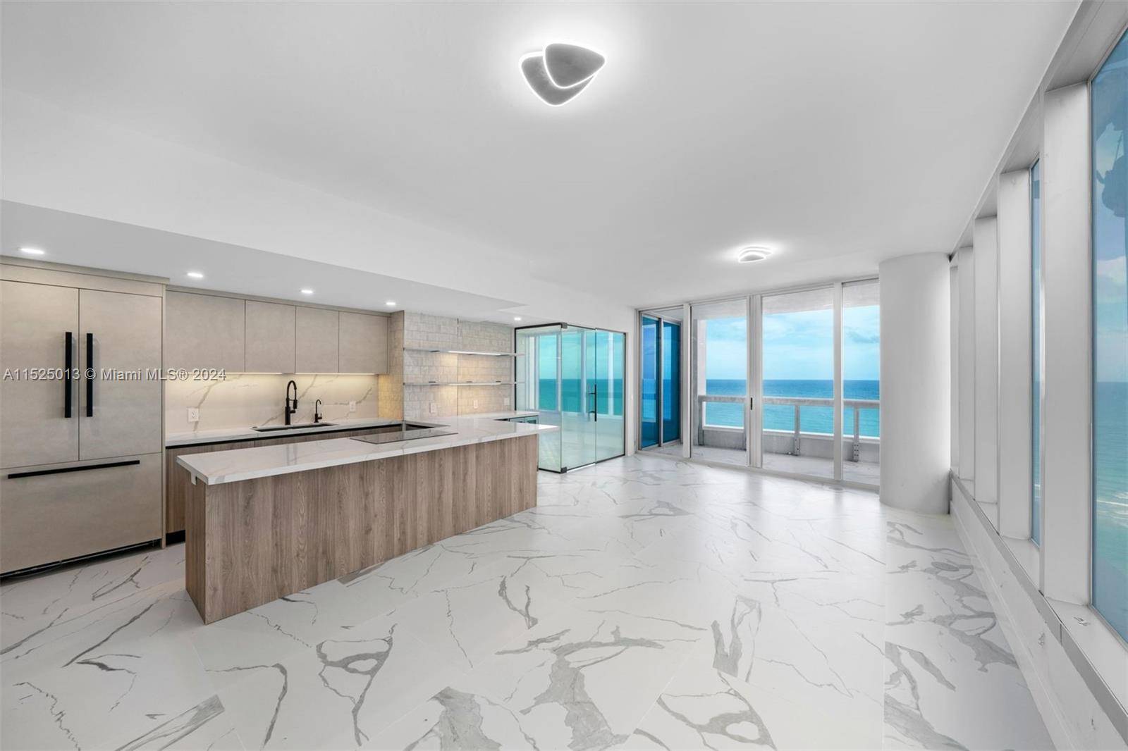 Live directly on the ocean in this impeccably renovated 2 Bed 2 Bath corner unit at the prestigious Carillon Wellness Resort North Tower.