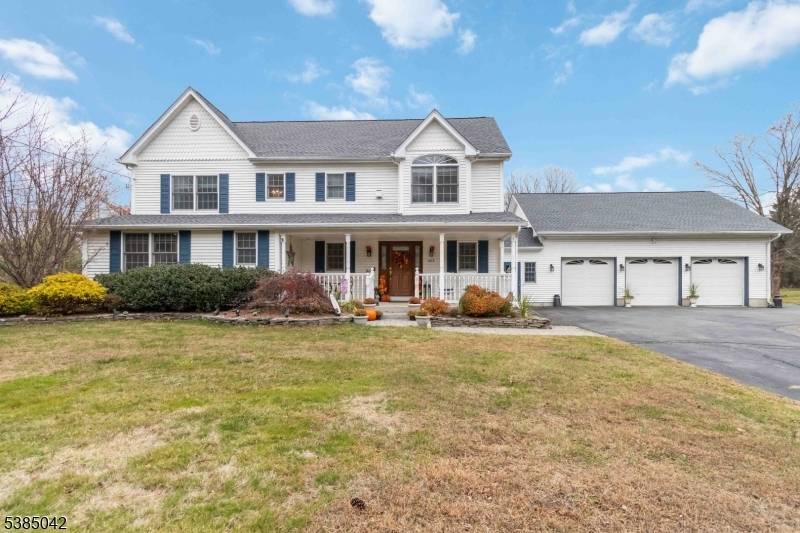 Welcome to this beautifully maintained center hall Colonial set on more than 1.