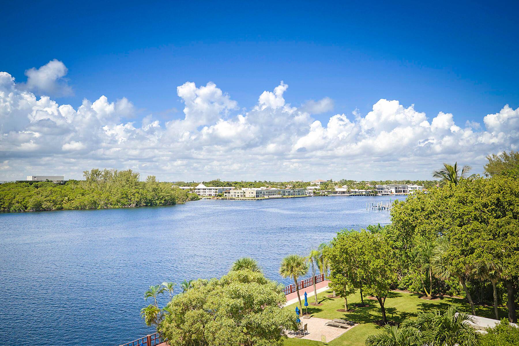 Elegantly remodeled CORNER UNIT with Multi Million Dollars views of the intracoastal, nature preserve park and the pool, totally surrounded by water.