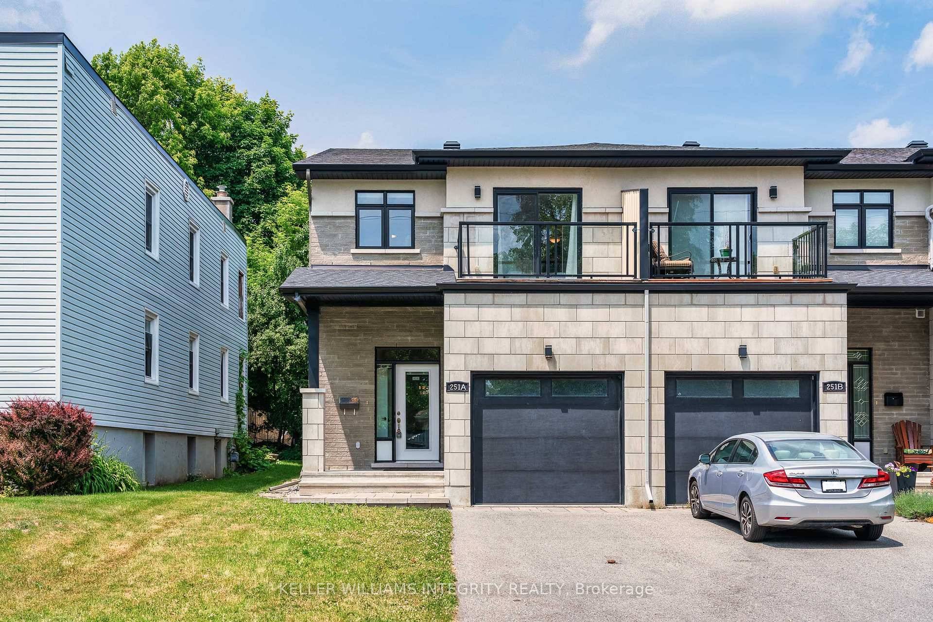 Welcome to 251A Glynn Avenue a beautifully designed end unit townhome that blends luxury, space, and an unbeatable central location.