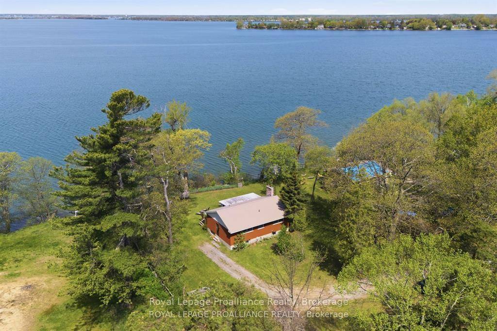 Home cottage on desirable West Lake with breathtaking sunset views overlooking the Sand Dunes of Sandbanks Provincial Park in Prince Edward County.