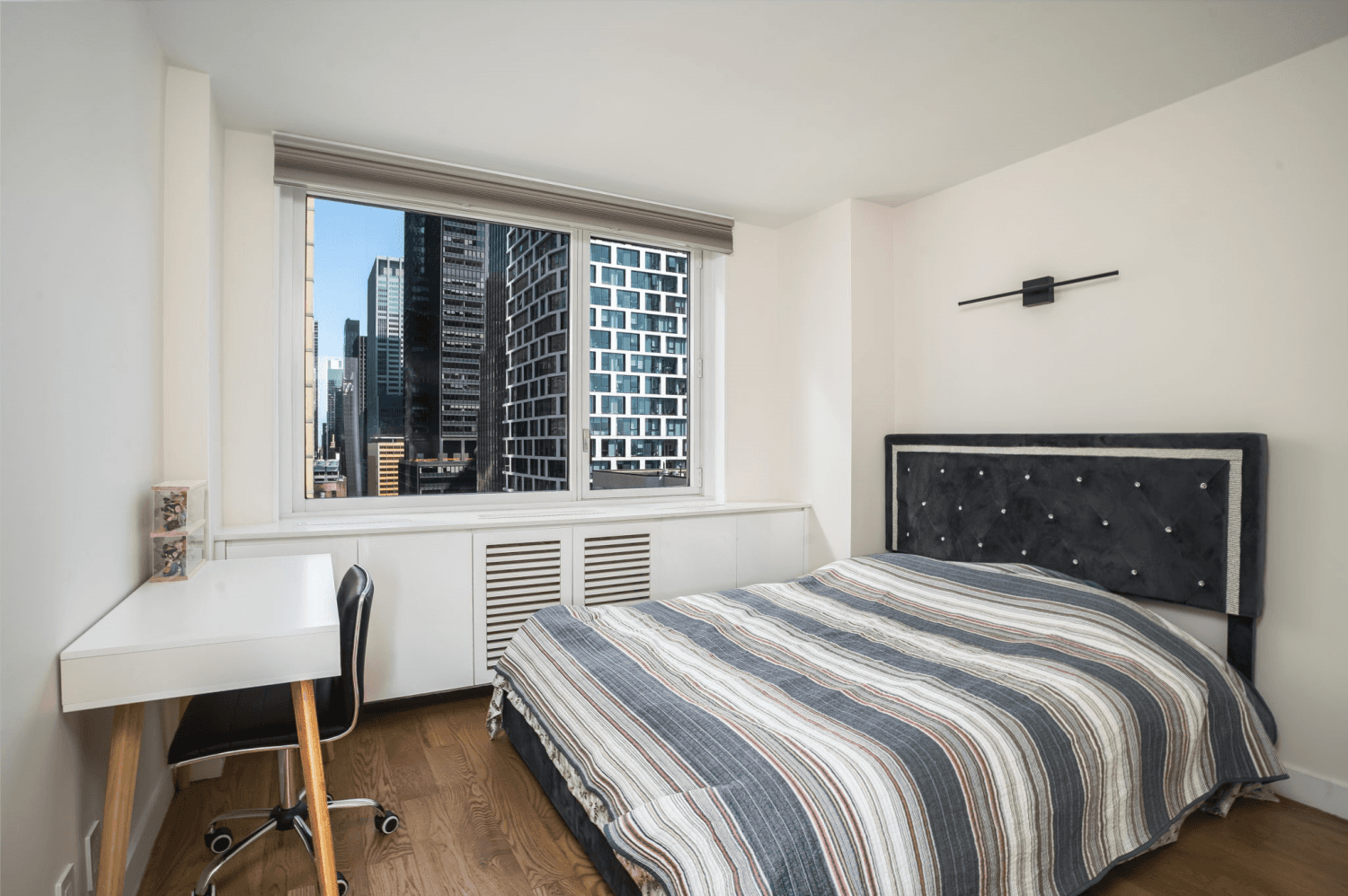Available immediately ! Welcome to unit 21K of Fifty Third and Eighth, at 301 West 53rd Street.