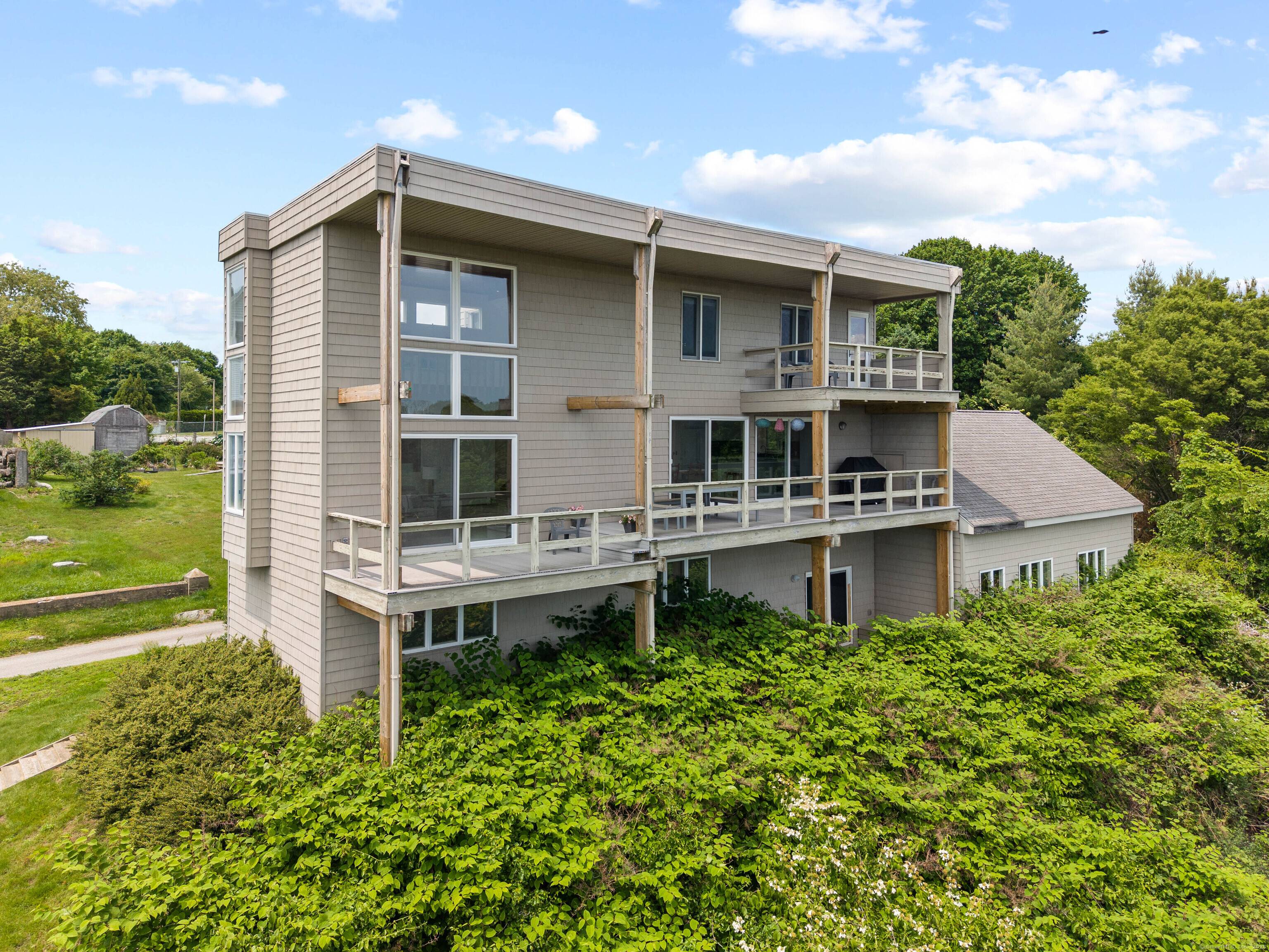Perched above it all, enjoy treetop views of the Long Island Sound and Spicer's Marina.