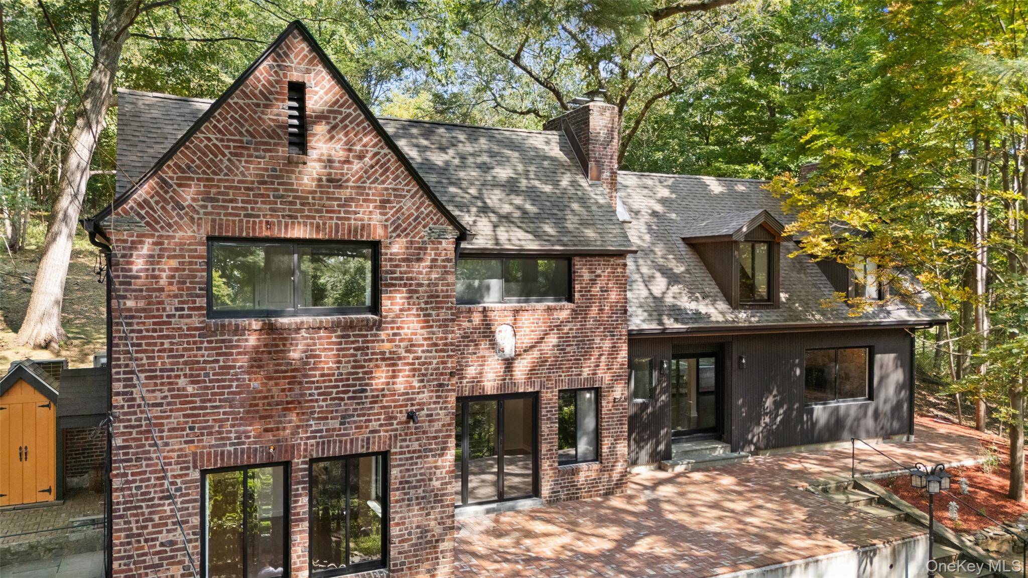 Presenting a complete interior and exterior renovation in design and construction showcasing contemporary bathrooms and an eat in kitchen with open concept living spaces !