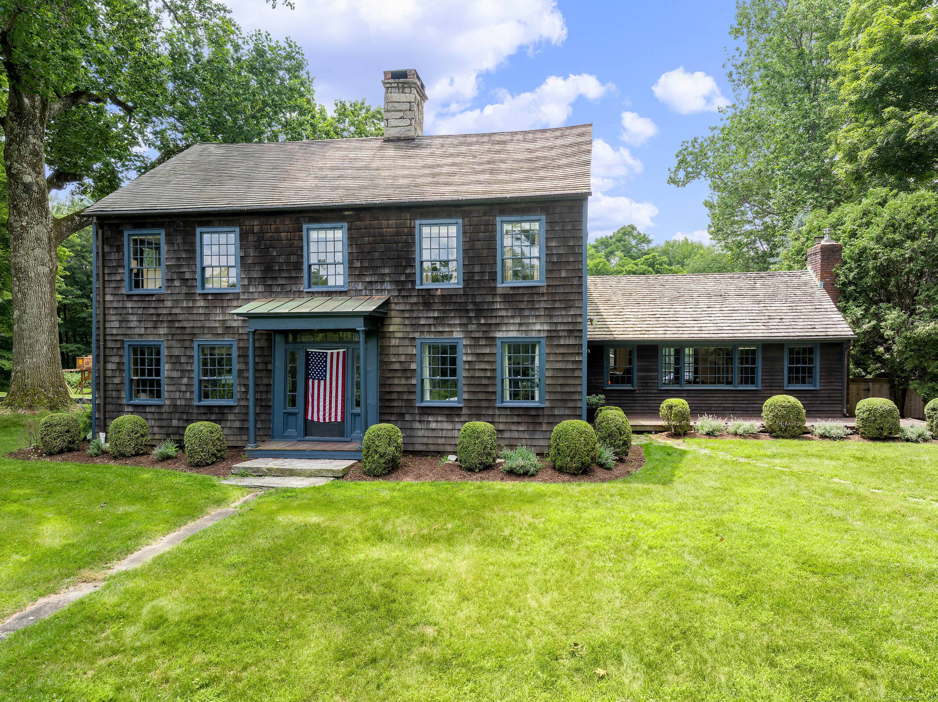 Enter this quintessential country retreat through stately stone pillars and a gated entry, where a beautifully renovated and expanded c.