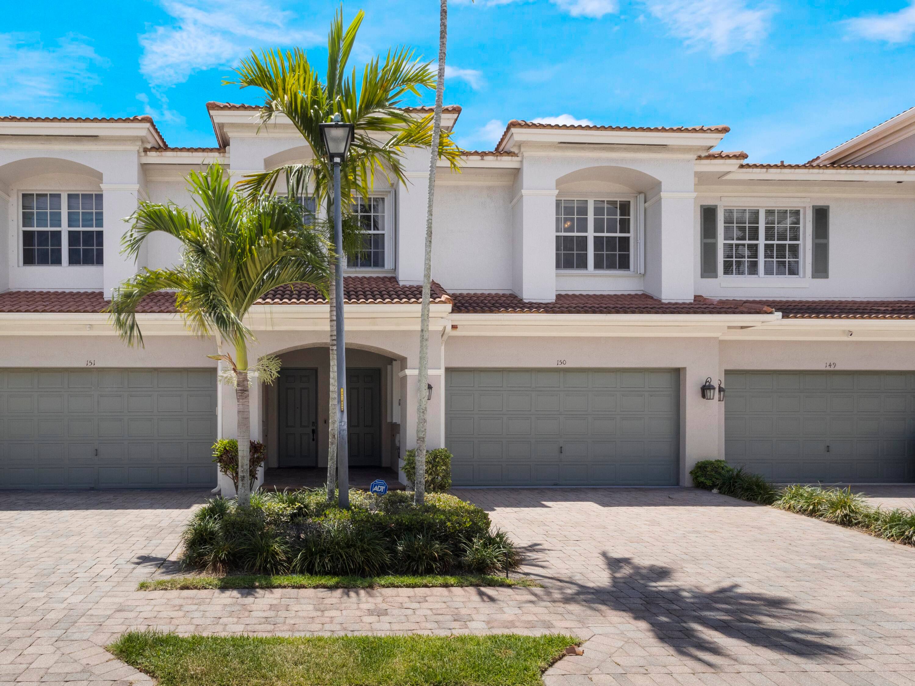 Welcome to an exceptional offering in the prestigious Carriage Pointe community, where modern sophistication and an unparalleled location converge.