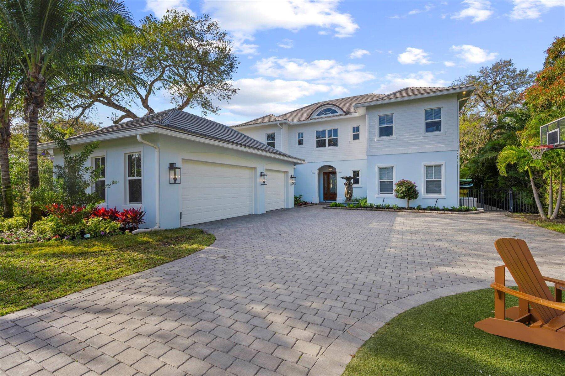 Don't miss this newer 2016 built Anglo Caribbean direct riverfront home on oversized.