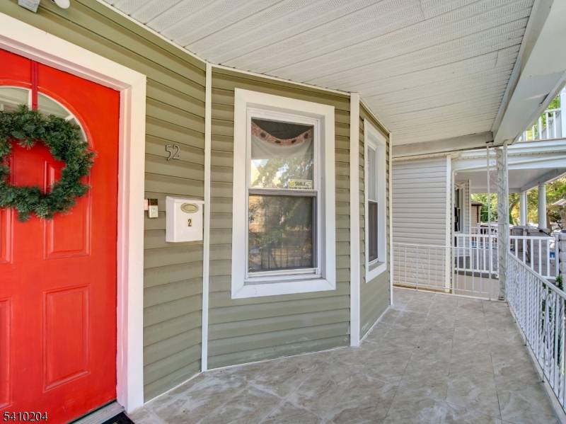 Welcome to this legal two family home, thoughtfully configured and offering exceptional space and flexibility.