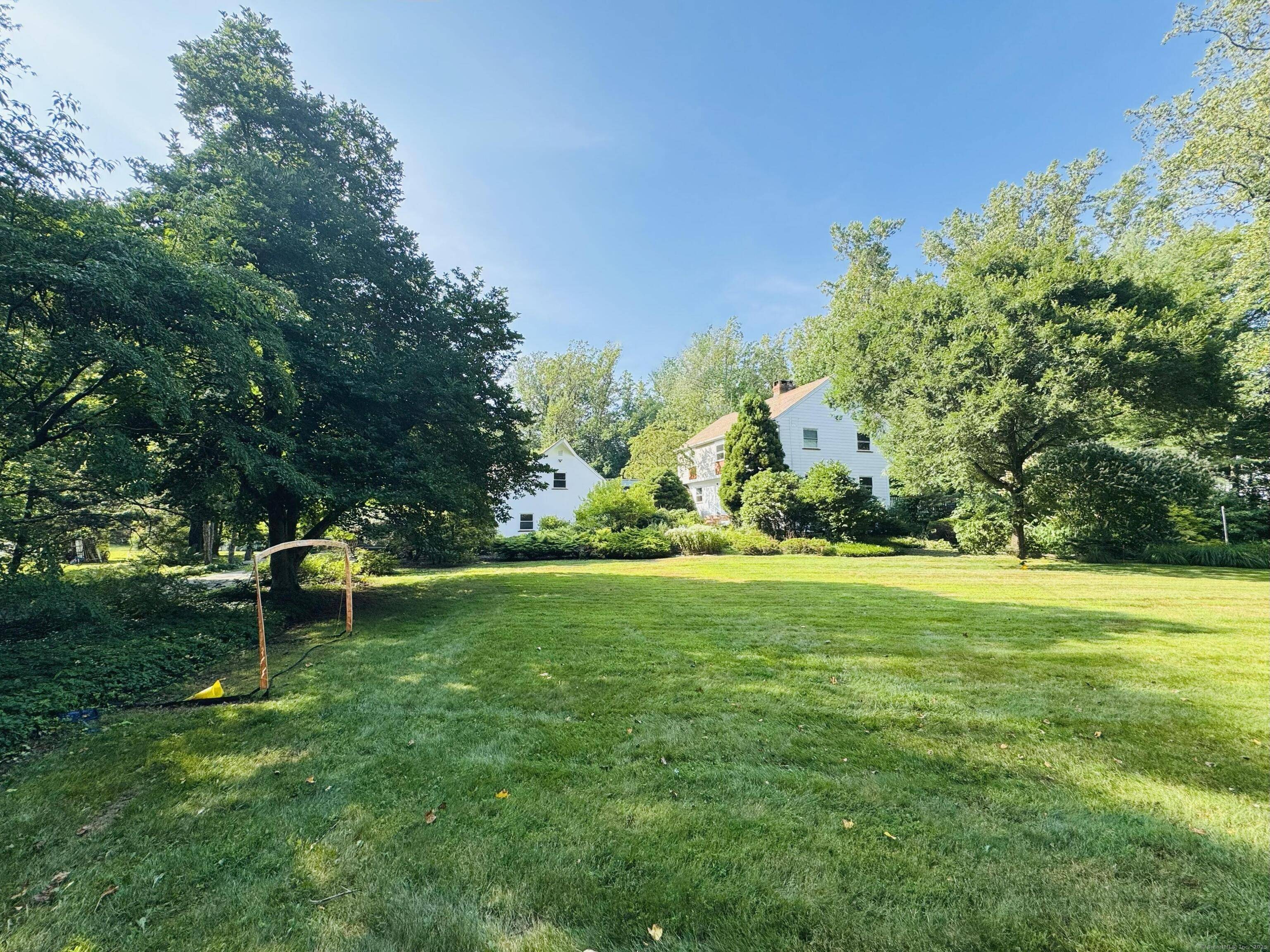 Premium finishes, expansive master suite with Jacuzzi and double shower, 3 fireplaces, office, walk out basement, 4 decks, 2 patios, wooded backyard with pond, flat grass front yard.
