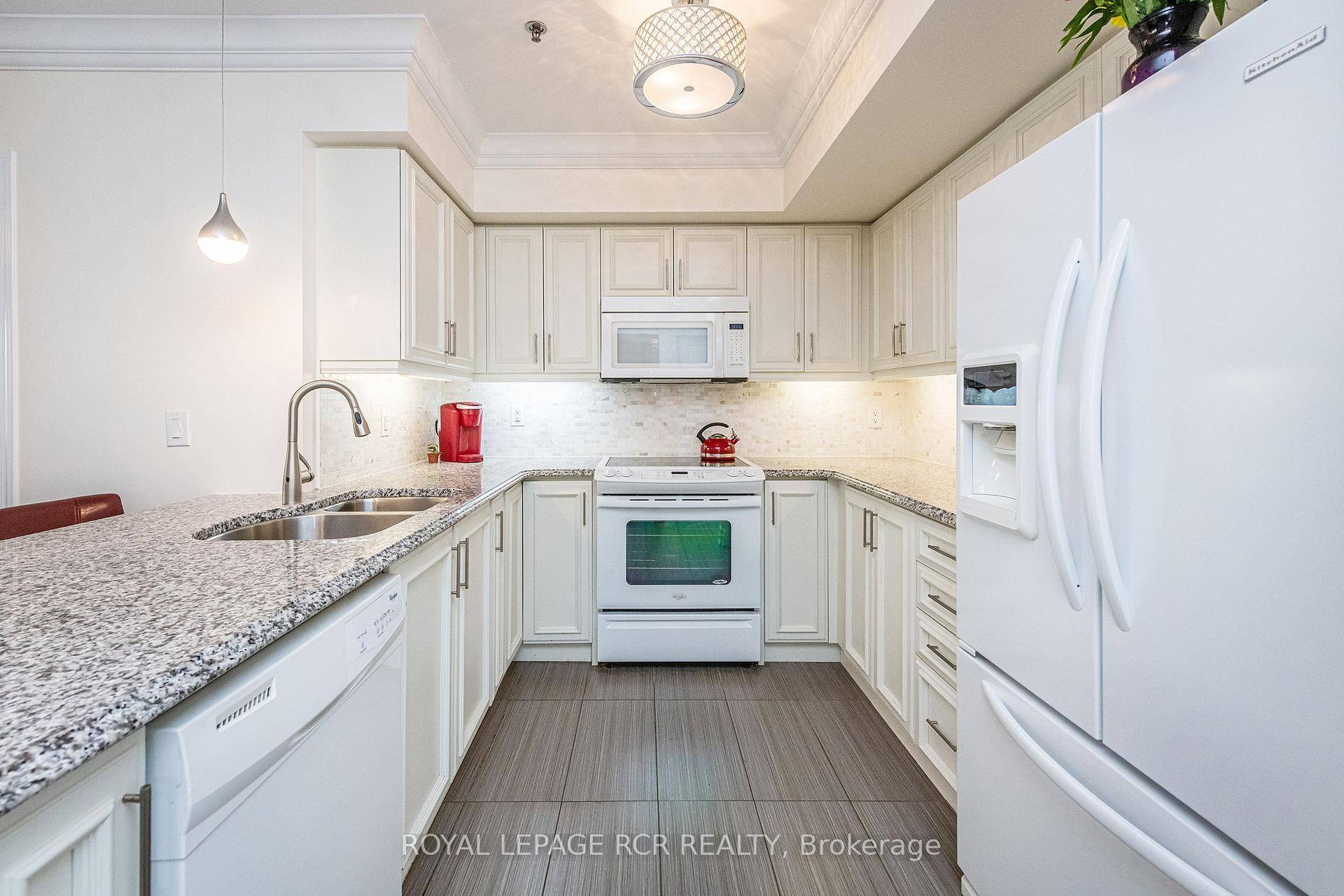 Offered for the first time ever, this beautifully upgraded two bedroom, two bathroom ground floor condo showcases true pride of ownership throughout.