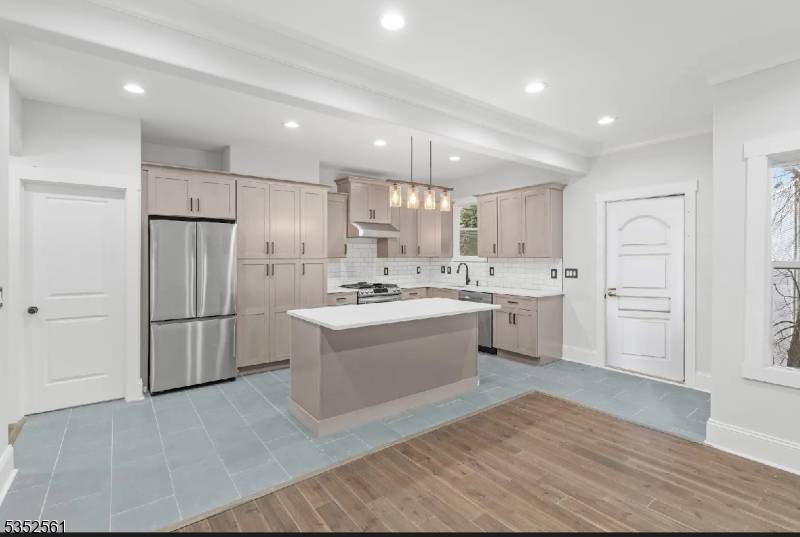 Step into this masterfully renovated gem nestled in Newark's sought after Clinton Hill section of the South Ward.