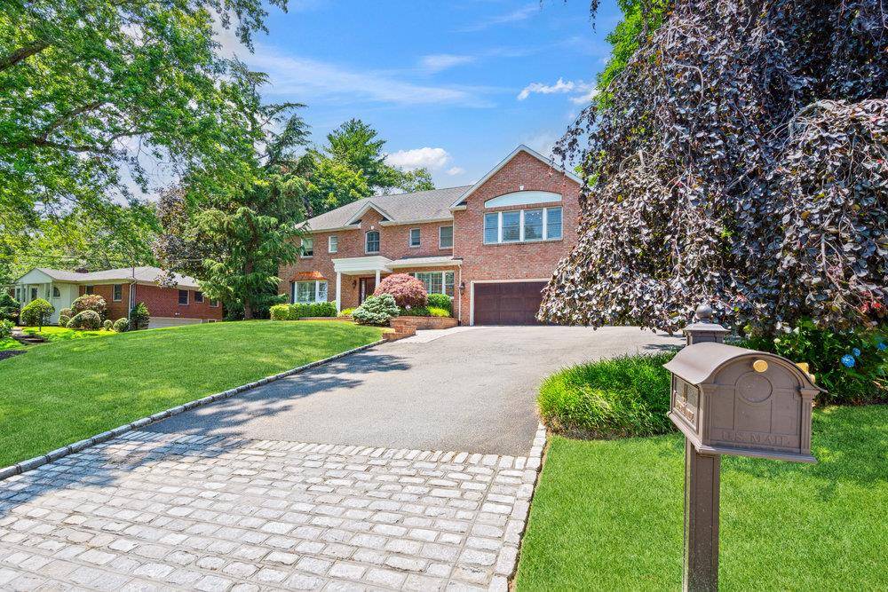 Welcome to 41 Hofstra Drive, a truly exceptional residence located mid block in the prestigious College Section of Plainview.