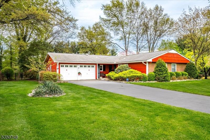 Welcome to this stunningly updated 3 bedroom, 2 bathroom ranch, ideally situated on a well manicured, fenced corner lot.