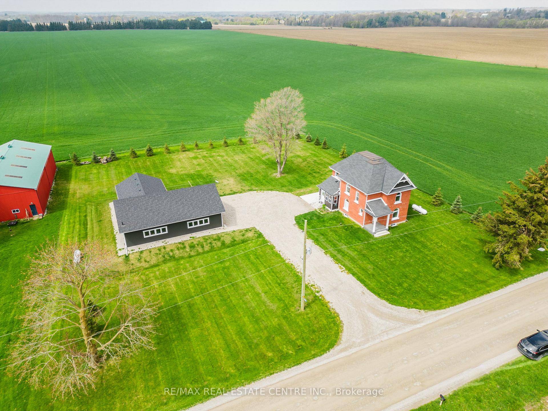 Fall in love with this classic red brick farmhouse that truly has it all !