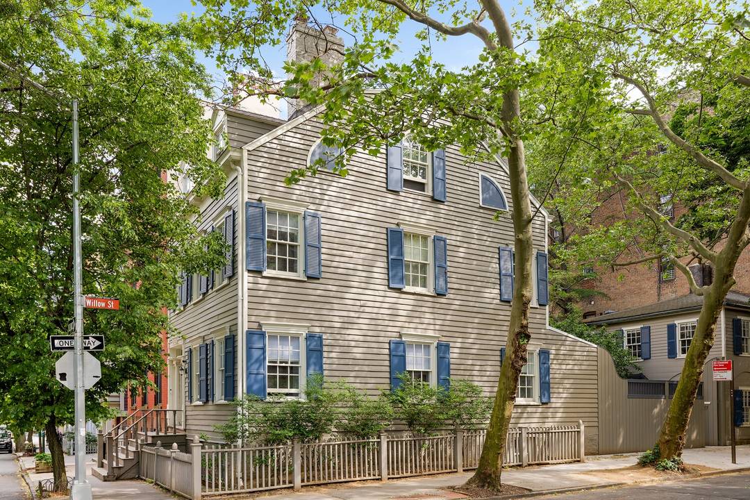 24 Middagh Street is a rare two family Brooklyn Heights compound featuring a fully rebuilt main house, a separate carriage house, and private parking, all centered around a private courtyard.