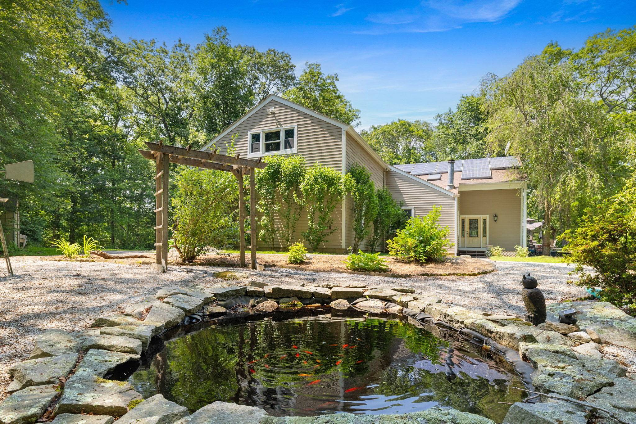 Discover a serene 2. 1 acre retreat in the heart of Mystic, where modern luxury meets tranquil privacy.
