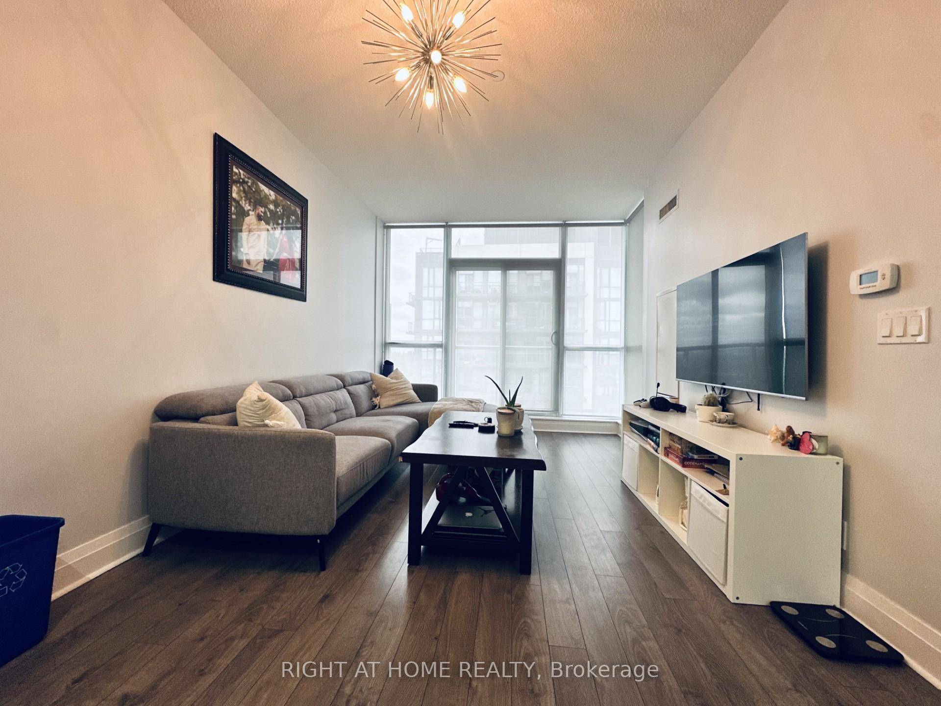 Stunning South facing condo with over 776 Sqft of living space including balcony, offering expansive city views from the living room, dining area, and bedroom.