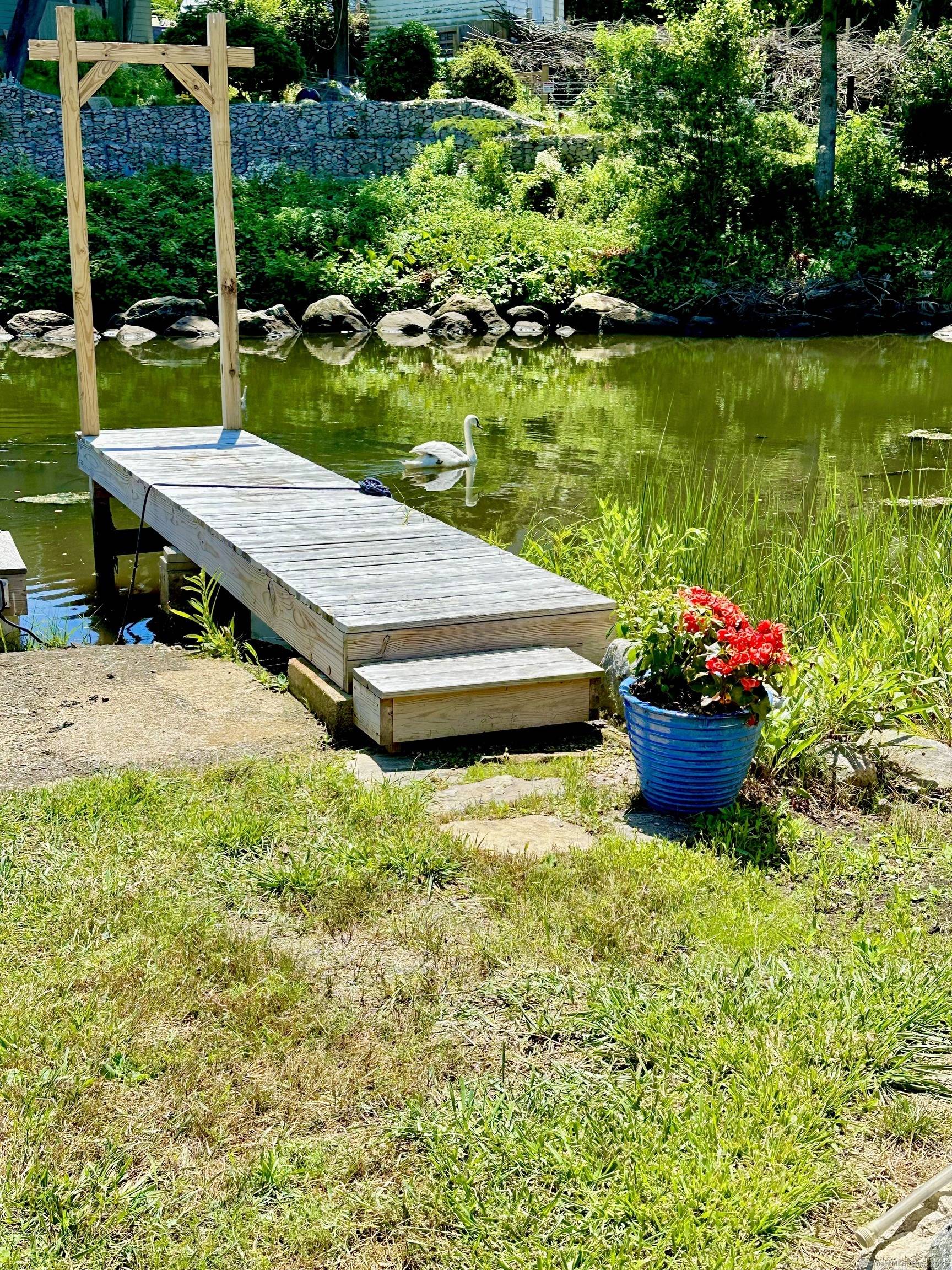 Waterfront Cottage on Saltwater Cove with Dock, Gardens Carriage House Potential Tucked along a peaceful saltwater cove, this charming 2 bedroom, 1.