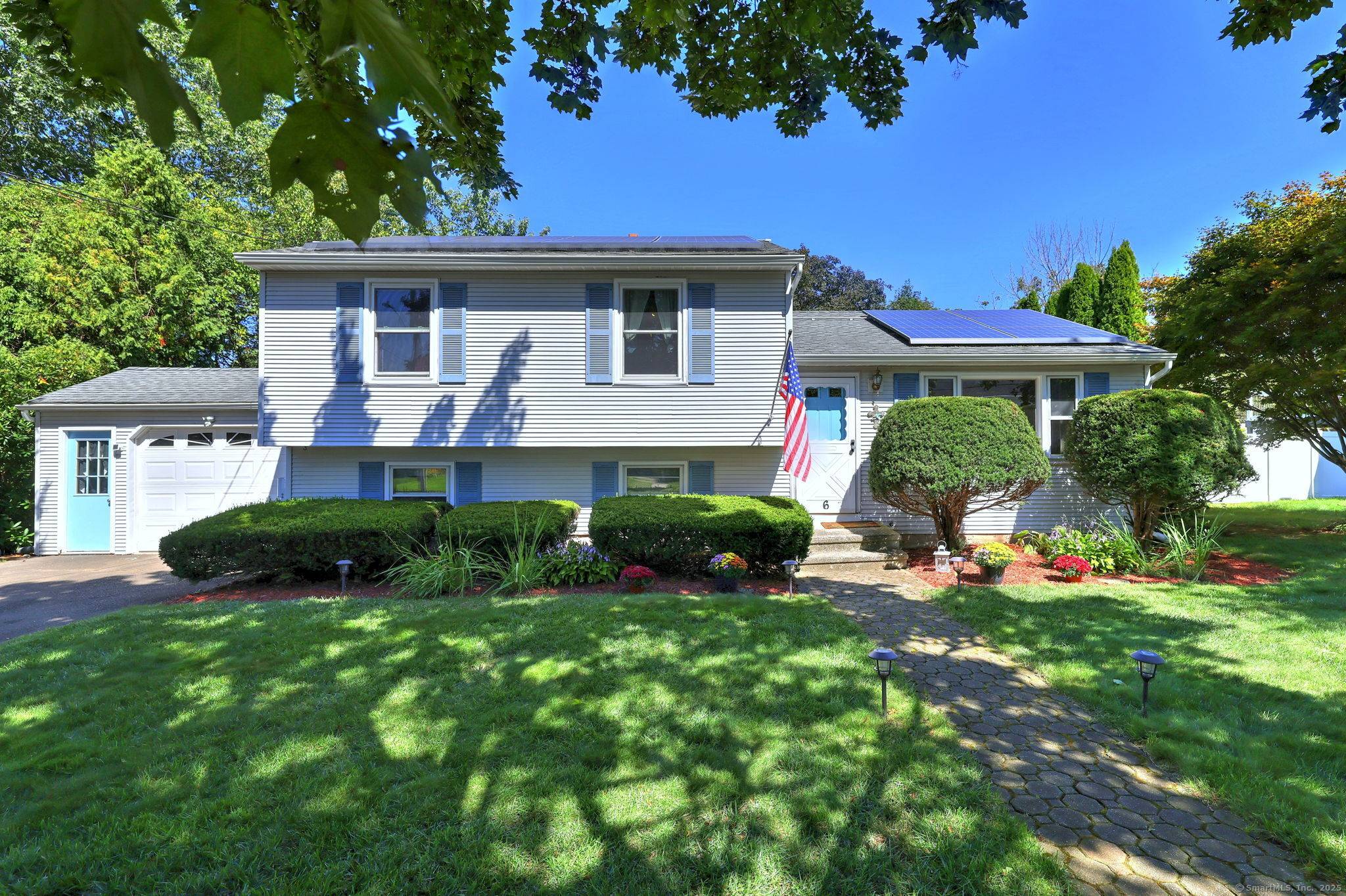 Welcome to this expanded split level home nestled on a quiet street in the desirable Mount Carmel neighborhood of Hamden.