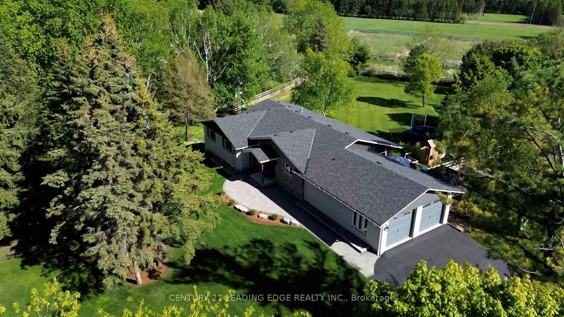 Experience the charm of this fully customized raised bungalow country estate, thoughtfully designed for luxurious and comfortable living.