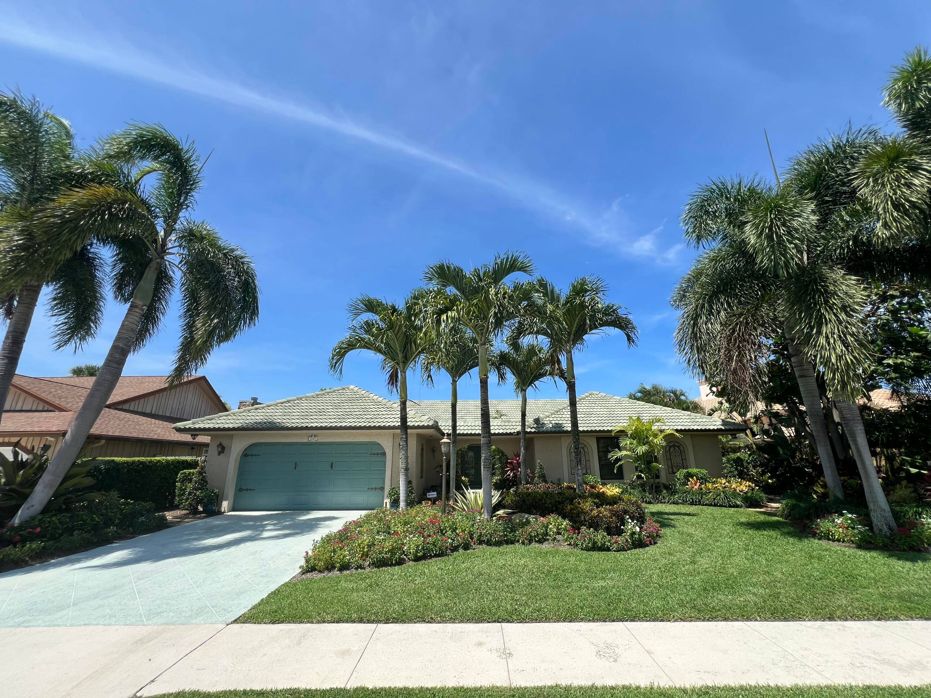 TROPICAL OASIS ! Lush Landscaping welcomes you to this beautiful One Story, CBS, 4 Bedroom 2 Full Bathroom sitting on a.