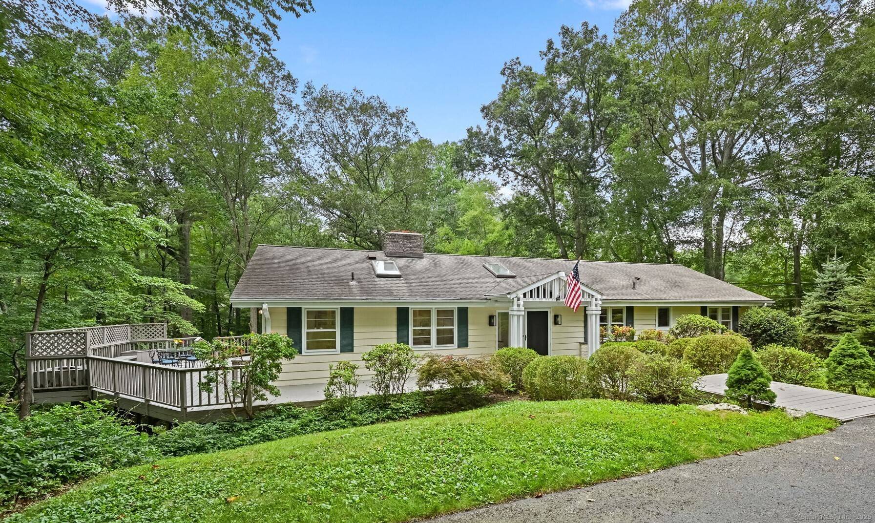 Enjoy a serene country retreat in this airy, light filled Ranch nestled in the sought after Saw Mill Association.