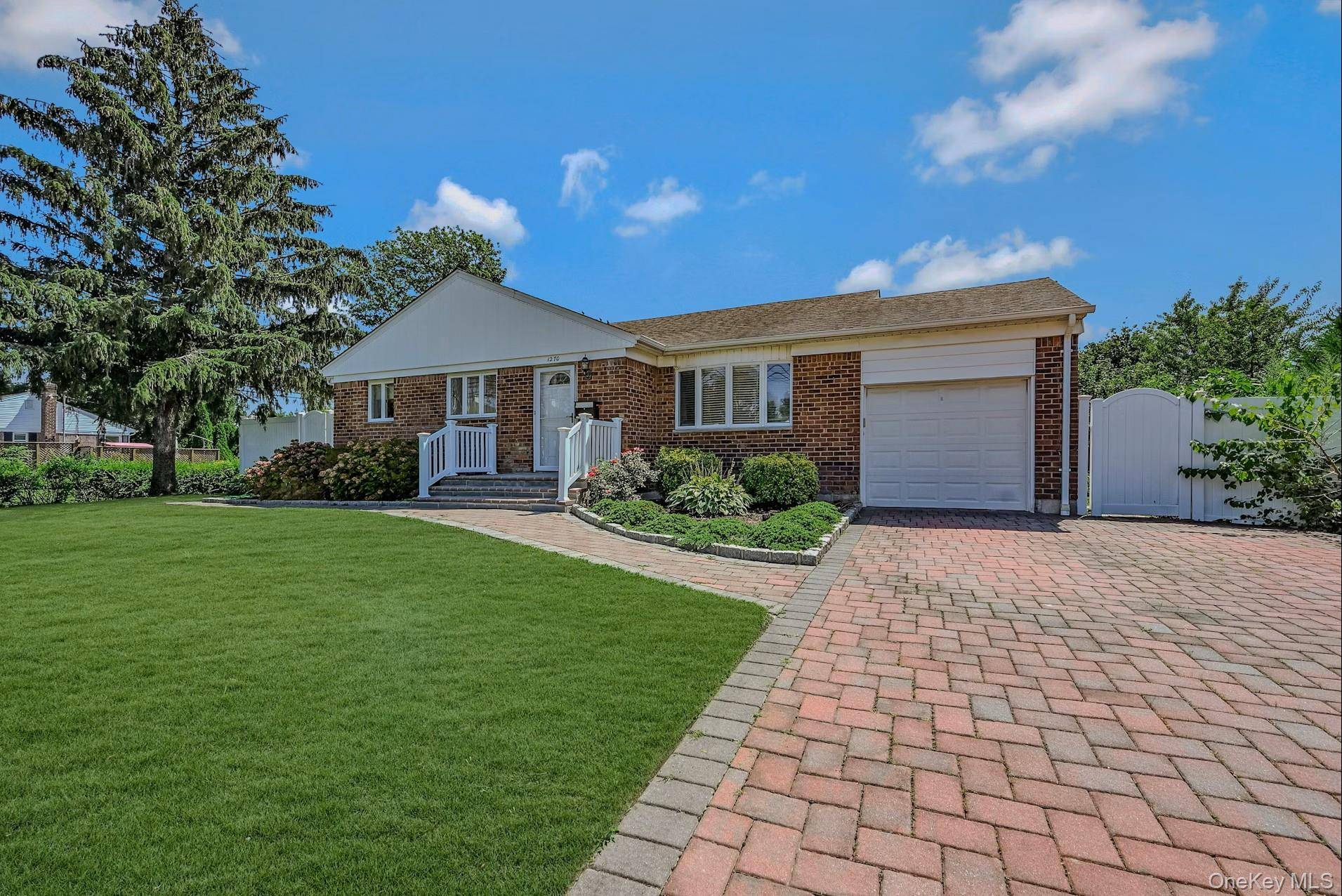 Charming three bedroom, one bath ranch on a quarter acre lot with attached garage.