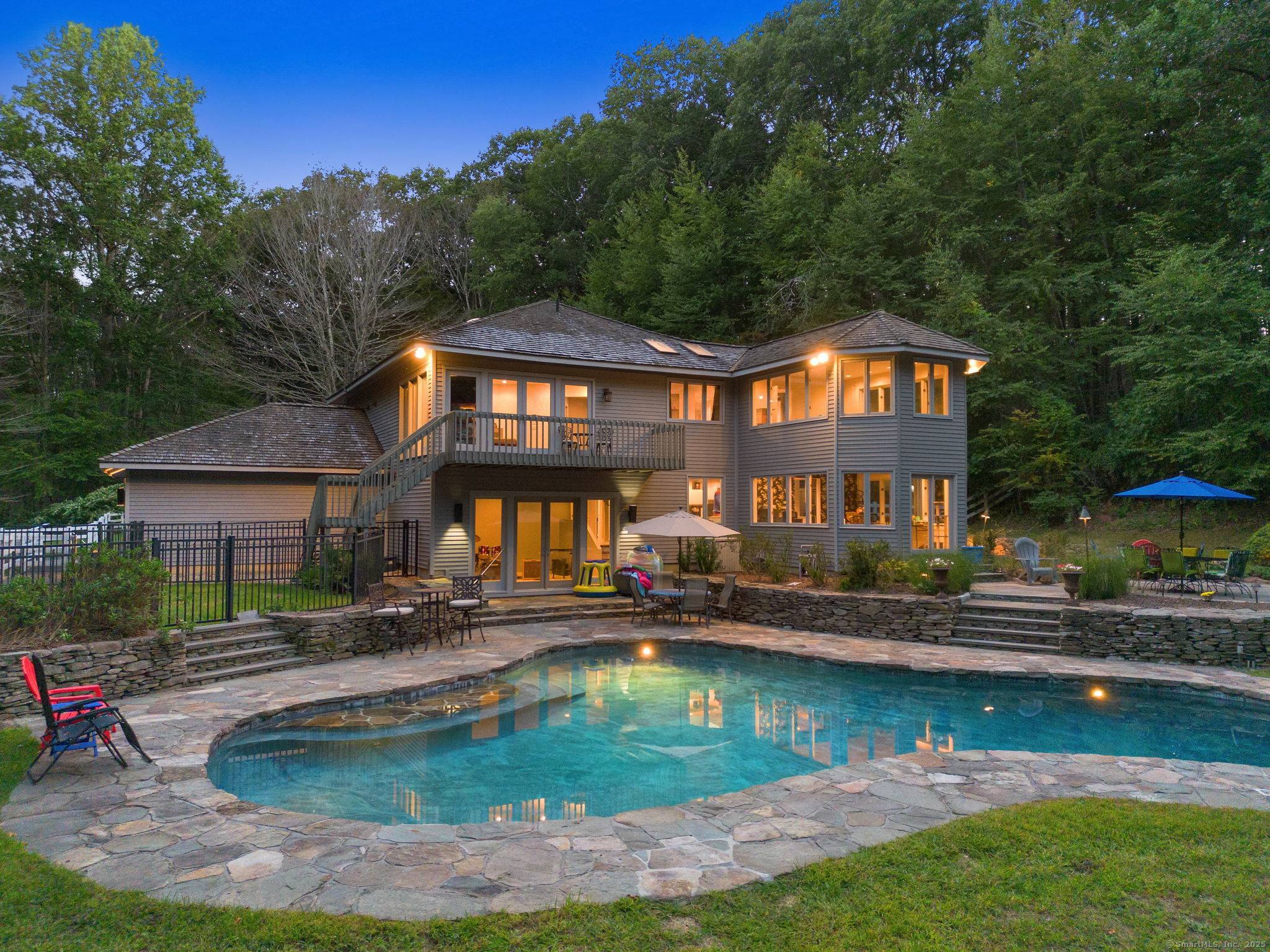 Tucked away in the picturesque hills of Litchfield County, right on the desirable Woodbury Roxbury line, this stunning Colonial Contemporary residence offers an unparalleled blend of privacy, natural beauty, and ...