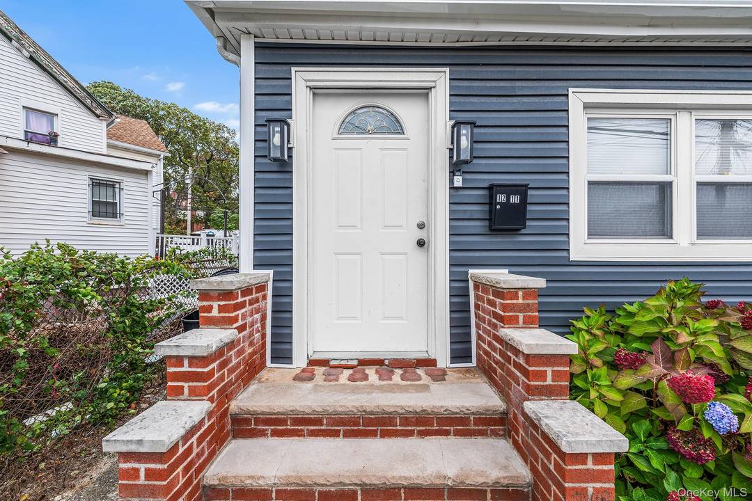 Beautifully maintained home showcasing a newer roof and a fully fenced yard for added privacy and appeal.