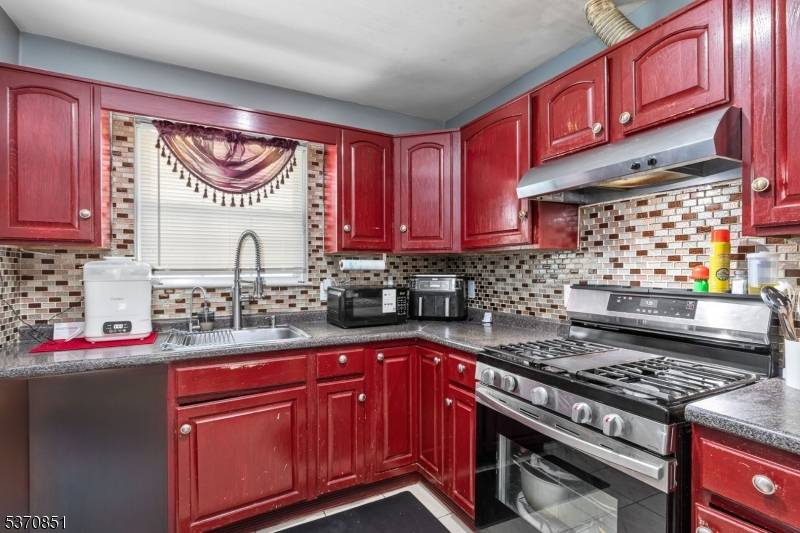 Large move in ready 2 family featuring 3 large bedrooms, 2 full baths, living room, dining room, kitchen on each level.