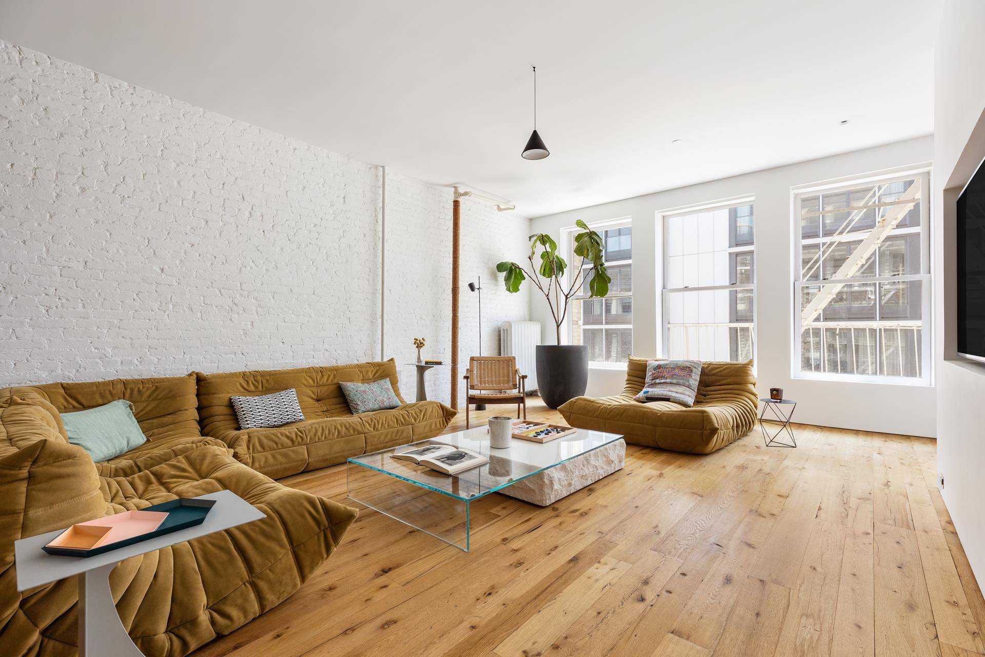 Classic Soho Loft with Private Balcony Step into this stunning loft where your private keyed elevator opens to reveal a seamless fusion of contemporary design and industrial chic.