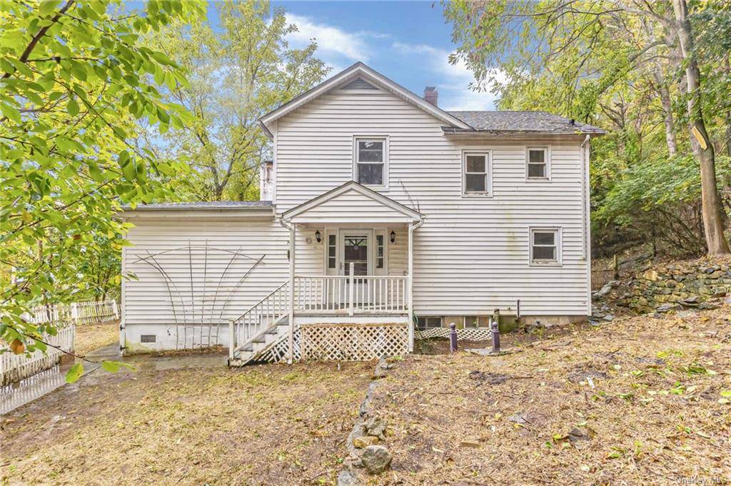Welcome to this spacious colonial nestled into the wooded hillside that features an in ground pool with deck and a studio unit above the detached 2 car garage.