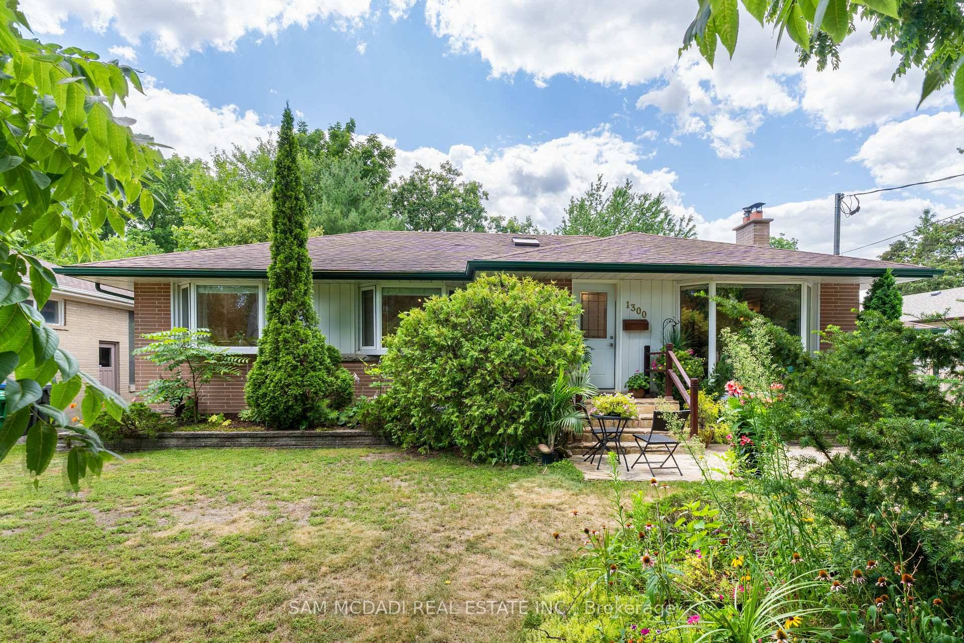 Welcome to 1300 Twin Oaks Dell, a beautifully maintained bungalow set on a generous 70 x 145 foot lot in prestigious Lorne Park.