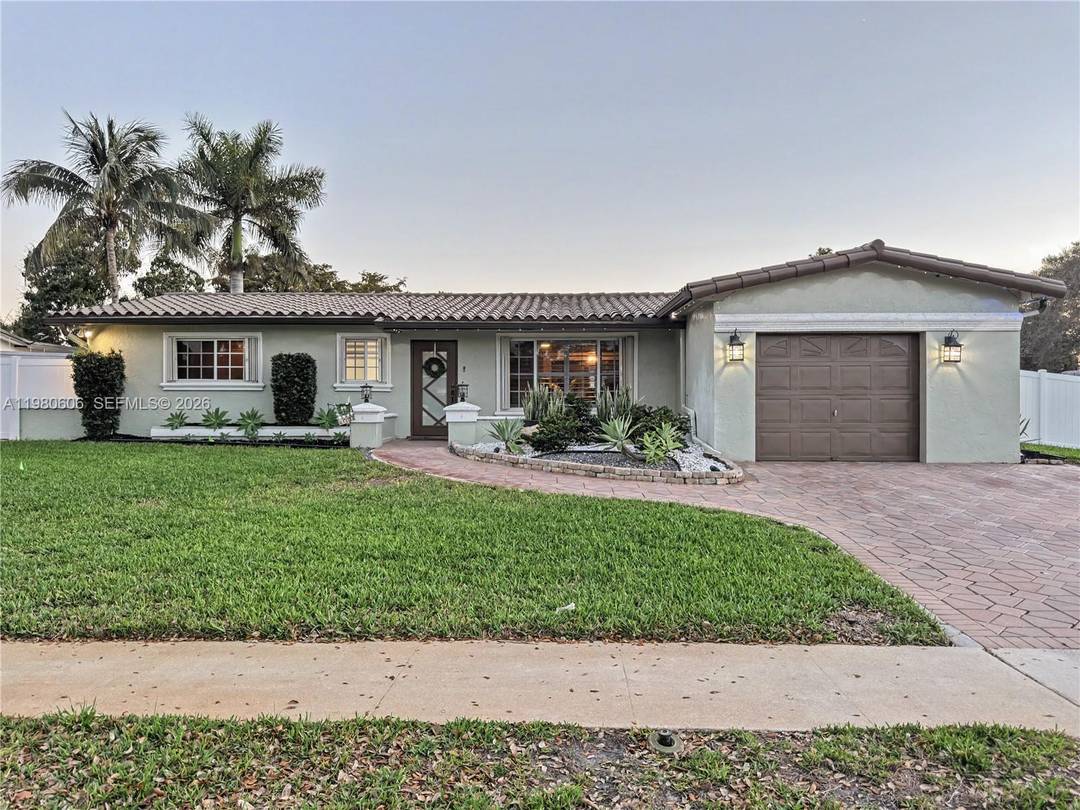 Beautifully maintained 4 bedroom 2 bath single family home situated on a spacious corner lot.